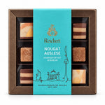 Reichert Nougat-Auslese mit neun Pralinen in einer türkisfarbenen Geschenkverpackung
